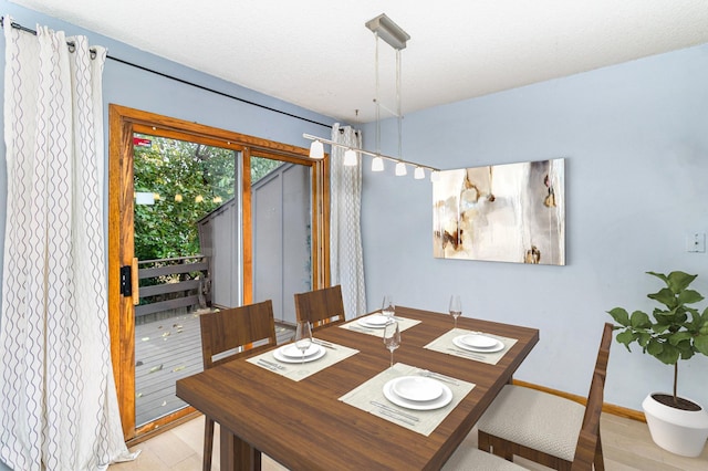 dining space with a textured ceiling