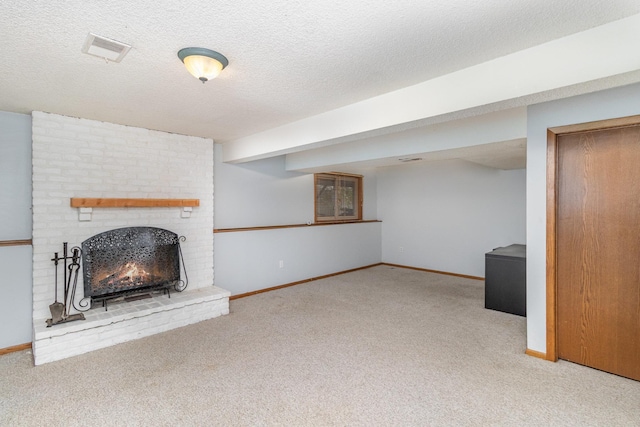 unfurnished living room with a brick fireplace, a textured ceiling, and carpet