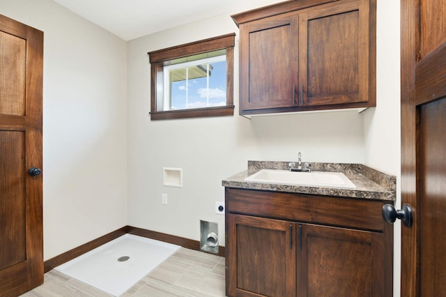 bathroom featuring a shower and vanity