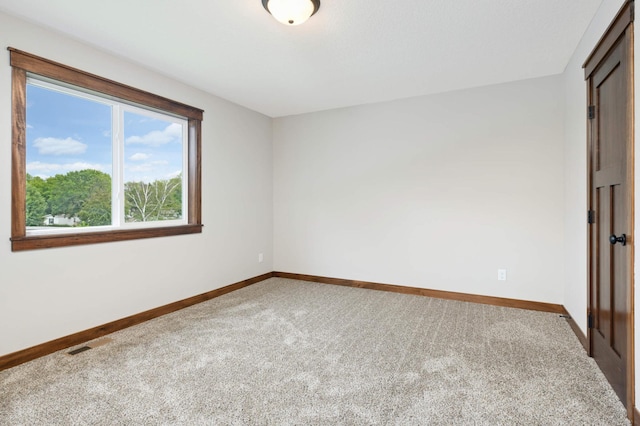 empty room featuring carpet flooring