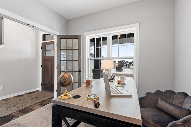 office space with dark wood-type flooring