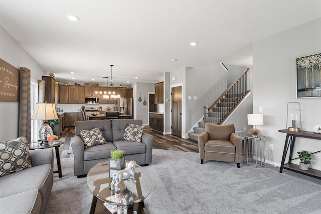 living room featuring hardwood / wood-style floors and a notable chandelier