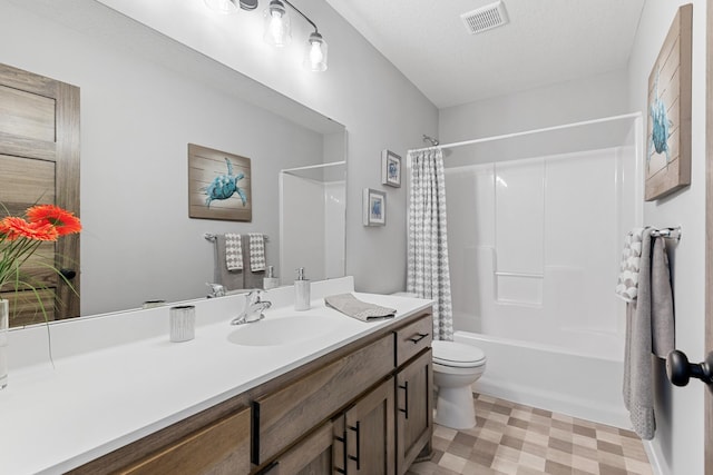 full bathroom with a textured ceiling, vanity, shower / tub combo, and toilet