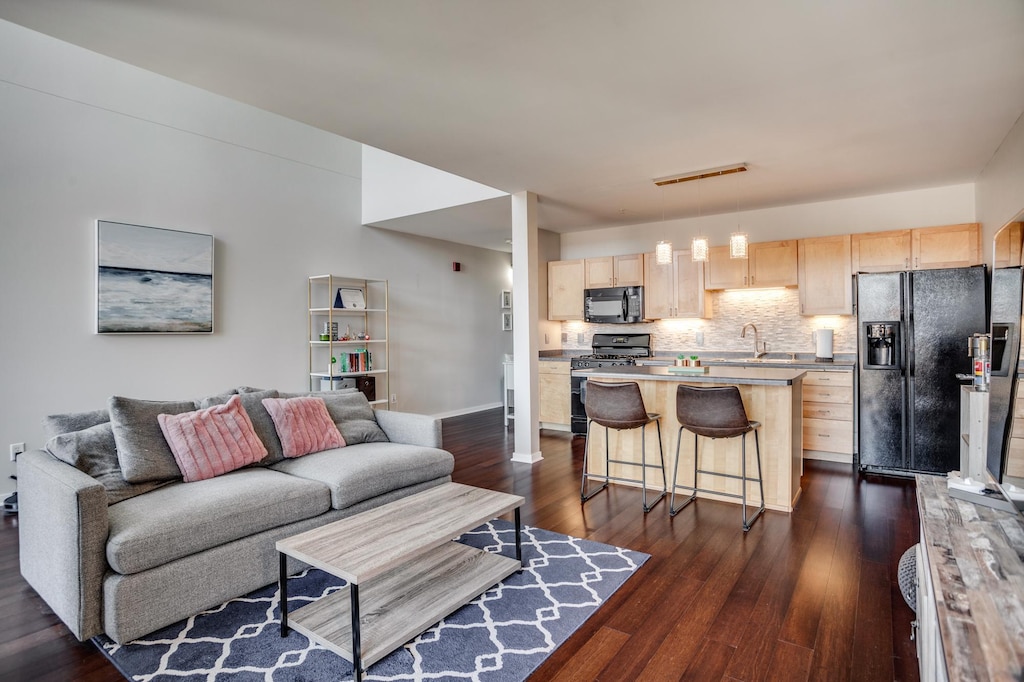 living room with dark hardwood / wood-style floors