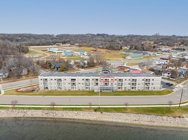 birds eye view of property with a water view