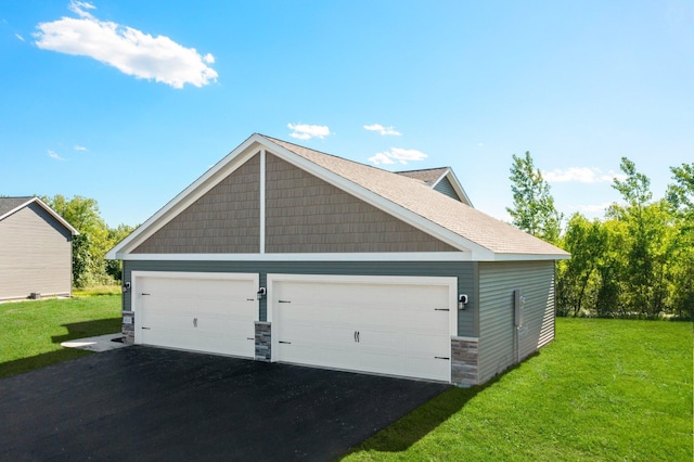 garage featuring a yard