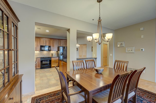 dining area featuring a chandelier