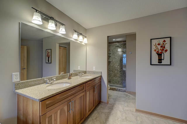 bathroom featuring walk in shower and vanity