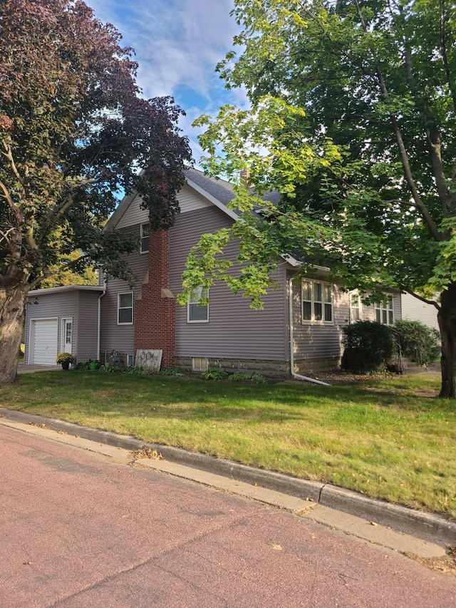 view of side of property featuring a yard