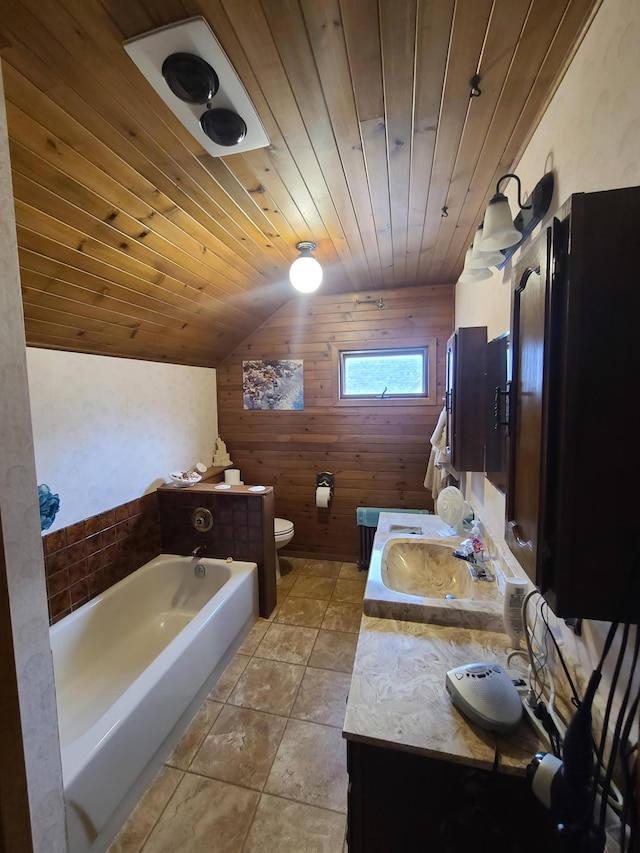 bathroom with wooden ceiling, a tub to relax in, vaulted ceiling, toilet, and vanity