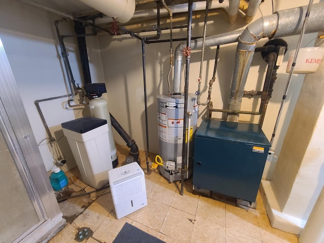 utility room featuring water heater