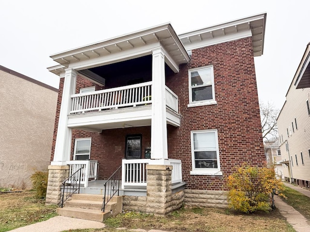 view of front facade with a porch and a balcony