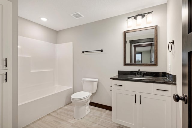 bathroom featuring shower / bath combination, baseboards, visible vents, toilet, and vanity