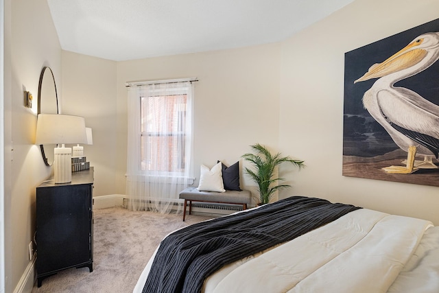 bedroom featuring light colored carpet