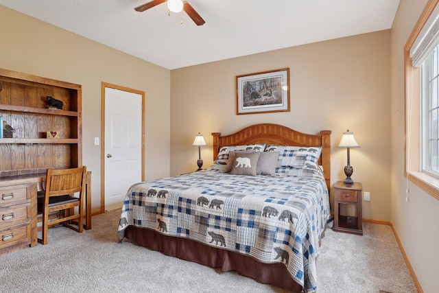 bedroom featuring light carpet and ceiling fan