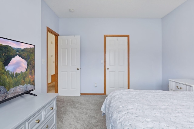 bedroom featuring light colored carpet