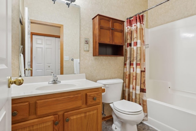 full bathroom with vanity, toilet, and shower / bath combo with shower curtain