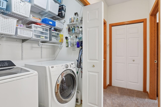 laundry room featuring carpet and separate washer and dryer