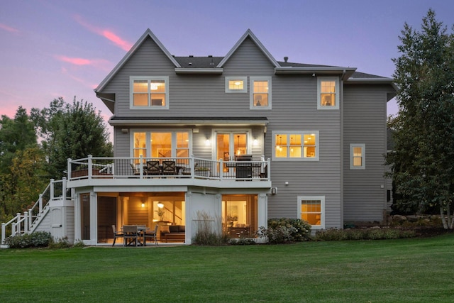 21360 Christmas Ln, Shorewood, MN 55331 - back of property at dusk with a patio area, stairway, and a lawn