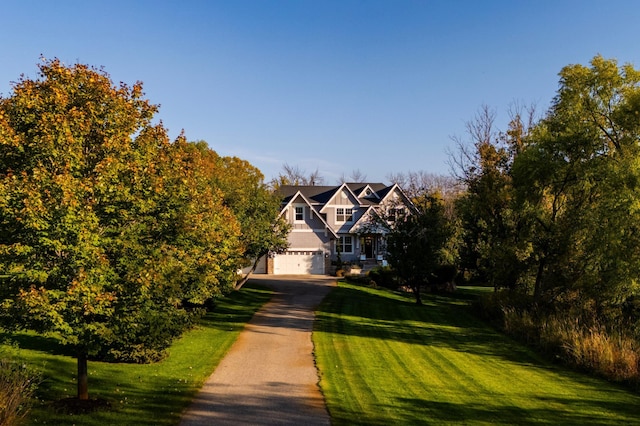 21360 Christmas Ln, Shorewood, MN 55331 - view of front of house with a front yard, an attached garage, and driveway