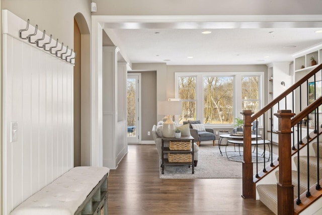 21360 Christmas Ln, Shorewood, MN 55331 - interior space with dark wood-style flooring, baseboards, and arched walkways