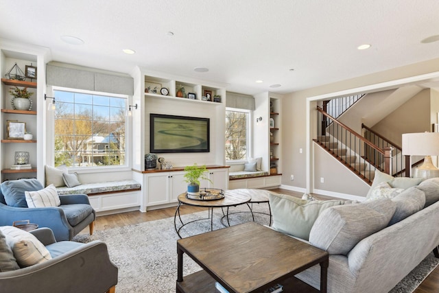 21360 Christmas Ln, Shorewood, MN 55331 - living area featuring stairway, plenty of natural light, light wood finished floors, and recessed lighting