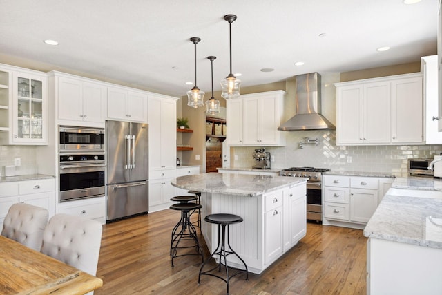 21360 Christmas Ln, Shorewood, MN 55331 - kitchen featuring wall chimney exhaust hood, open shelves, a kitchen island, premium appliances, and decorative backsplash