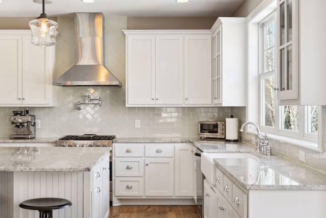 21360 Christmas Ln, Shorewood, MN 55331 - kitchen featuring white cabinets, wall chimney exhaust hood, and decorative backsplash