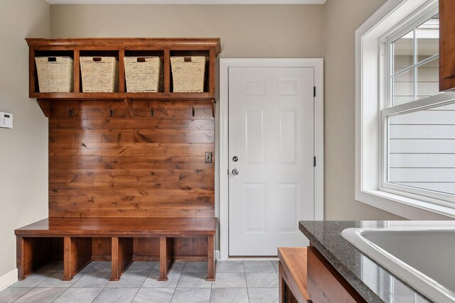 21360 Christmas Ln, Shorewood, MN 55331 - mudroom with light tile patterned floors and a sink