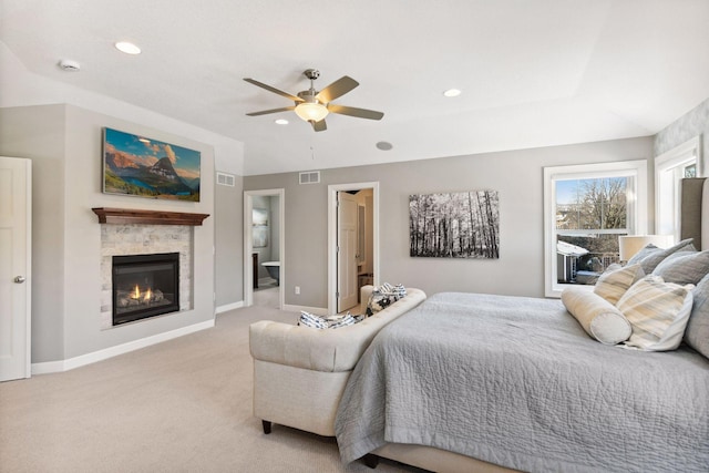 21360 Christmas Ln, Shorewood, MN 55331 - bedroom with light carpet, a glass covered fireplace, visible vents, and baseboards