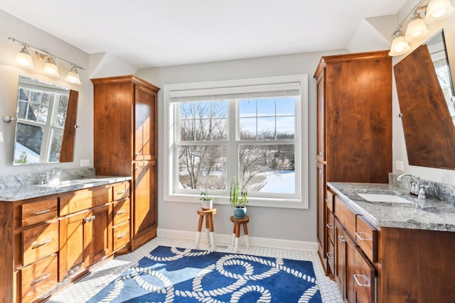 21360 Christmas Ln, Shorewood, MN 55331 - bathroom featuring a sink, two vanities, and baseboards