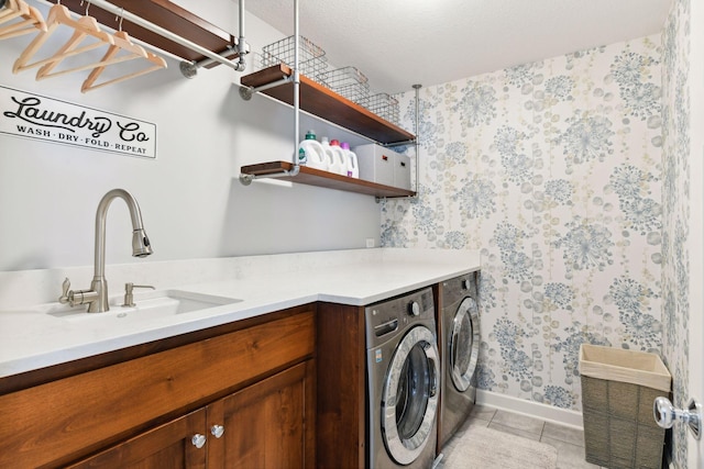 21360 Christmas Ln, Shorewood, MN 55331 - washroom featuring light tile patterned floors, washer and dryer, a sink, laundry area, and wallpapered walls