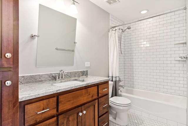 21360 Christmas Ln, Shorewood, MN 55331 - bathroom with vanity, visible vents, toilet, tile patterned floors, and shower / bath combo with shower curtain