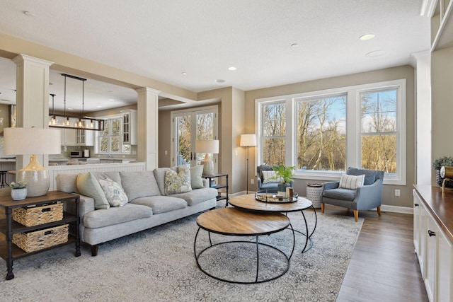 21360 Christmas Ln, Shorewood, MN 55331 - living area featuring recessed lighting, ornate columns, baseboards, and wood finished floors