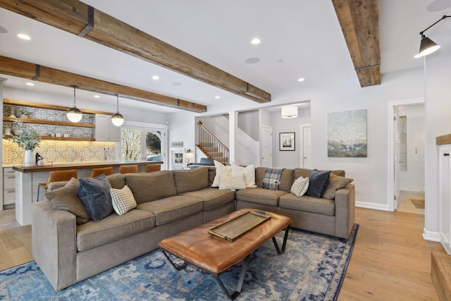 21360 Christmas Ln, Shorewood, MN 55331 - living room featuring beamed ceiling, recessed lighting, stairway, light wood finished floors, and baseboards