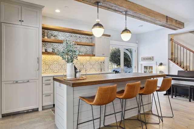 21360 Christmas Ln, Shorewood, MN 55331 - bar with recessed lighting, light wood-style flooring, backsplash, stairs, and decorative light fixtures
