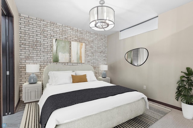 bedroom featuring a chandelier and carpet floors