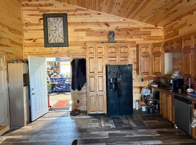 kitchen featuring wood walls, black fridge with ice dispenser, and lofted ceiling