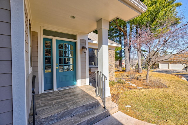 entrance to property featuring brick siding