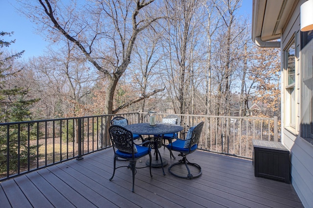 wooden terrace with outdoor dining space