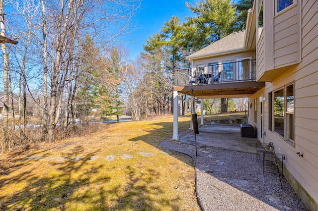 view of yard featuring a deck and a patio area