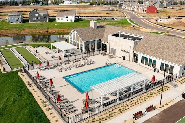 view of swimming pool with a water view