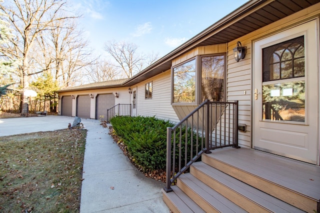 doorway to property featuring a garage