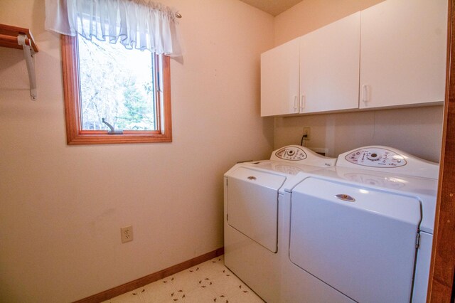 laundry room featuring cabinets and independent washer and dryer