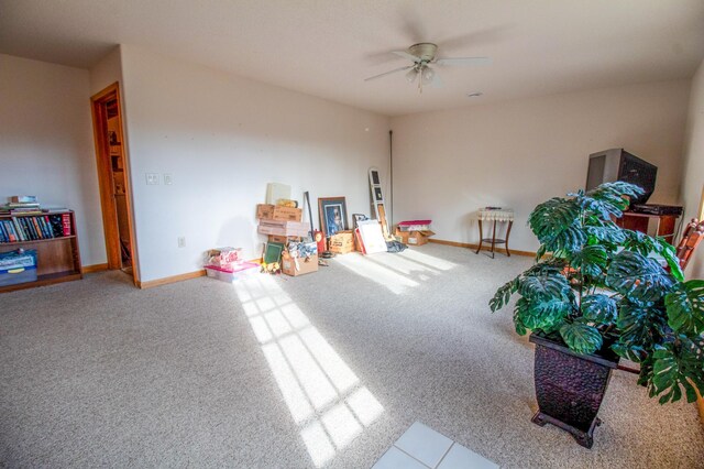 rec room with carpet floors and ceiling fan