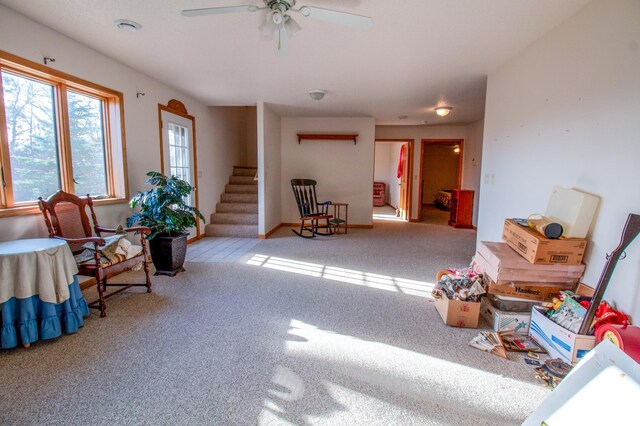 sitting room with light carpet and ceiling fan