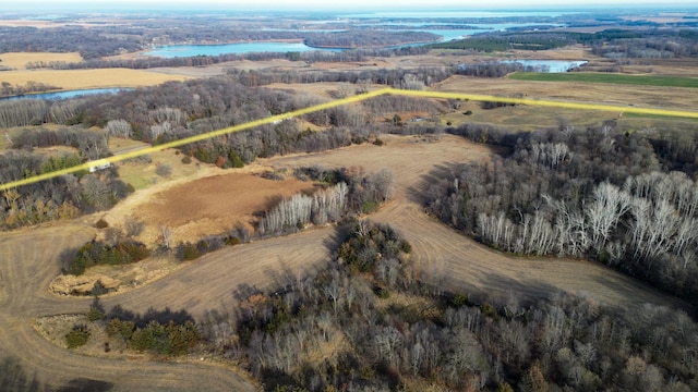 birds eye view of property with a rural view and a water view