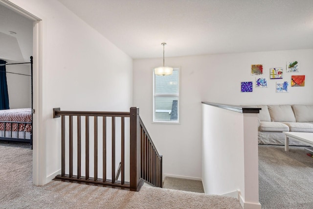 stairway with carpet floors and baseboards