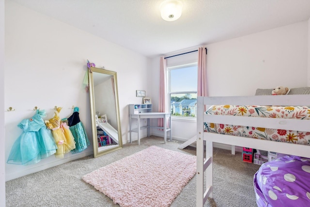 bedroom featuring carpet flooring and baseboards