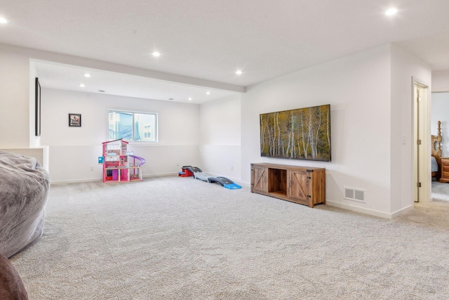 rec room featuring carpet, visible vents, and baseboards